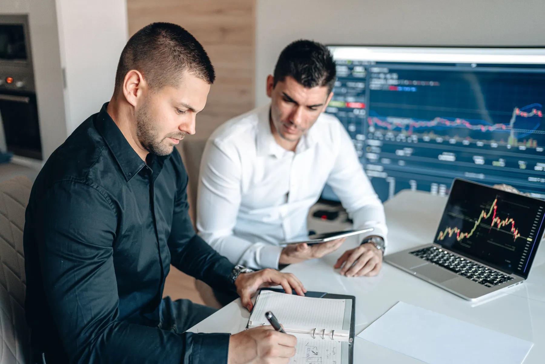 Marketing performance charts being reviewed on a laptop